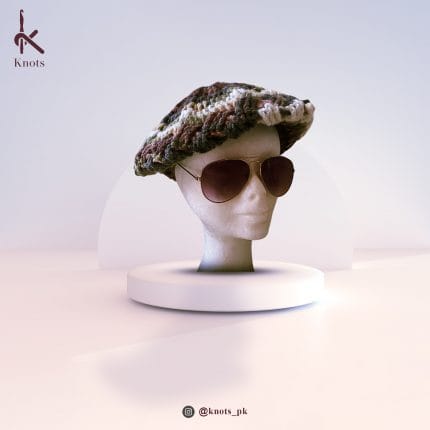 a dummy wearing hand-made Crocheted Barret cap